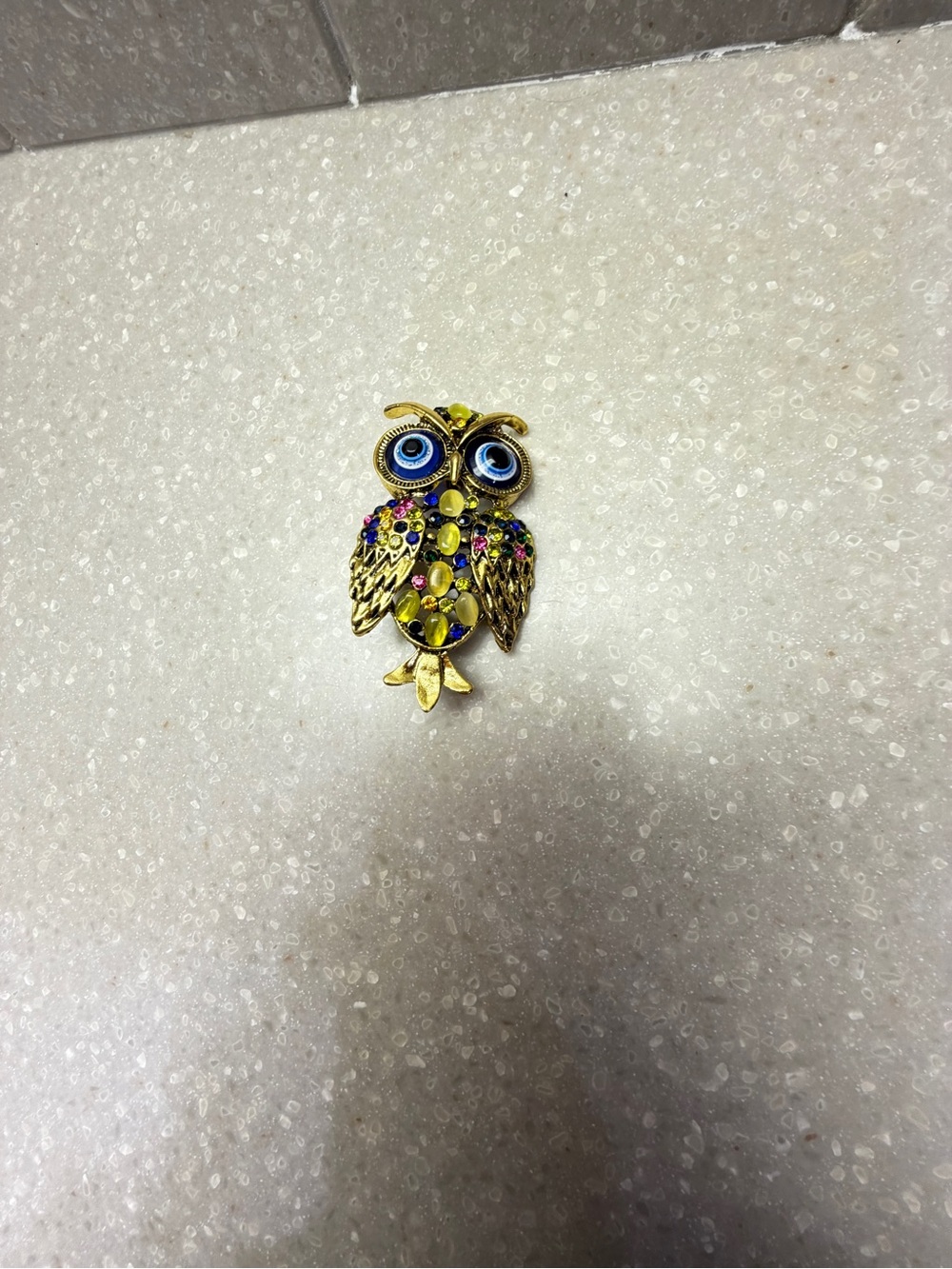 Jewelry - Brooch.  Jeweled owl with big blue eyes.